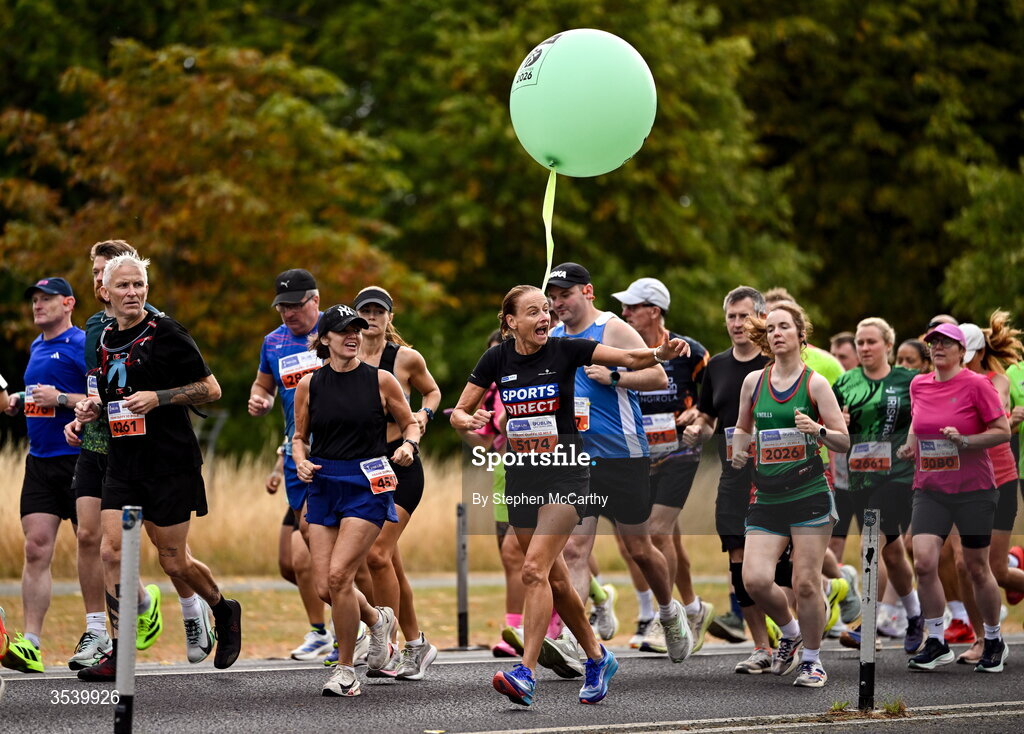 15 August 2026; Athletes, including Sharon Woods and a pacer during the 2026 Irish Life Frank Duffy 10 Mile, in the Phoenix Park, Dublin. Thousands of runners took part in the sold out Irish Life Frank Duffy 10 Mile, the second event in the 2026 Irish Life Dublin Race Series. Photo by Stephen McCarthy/Sportsfile