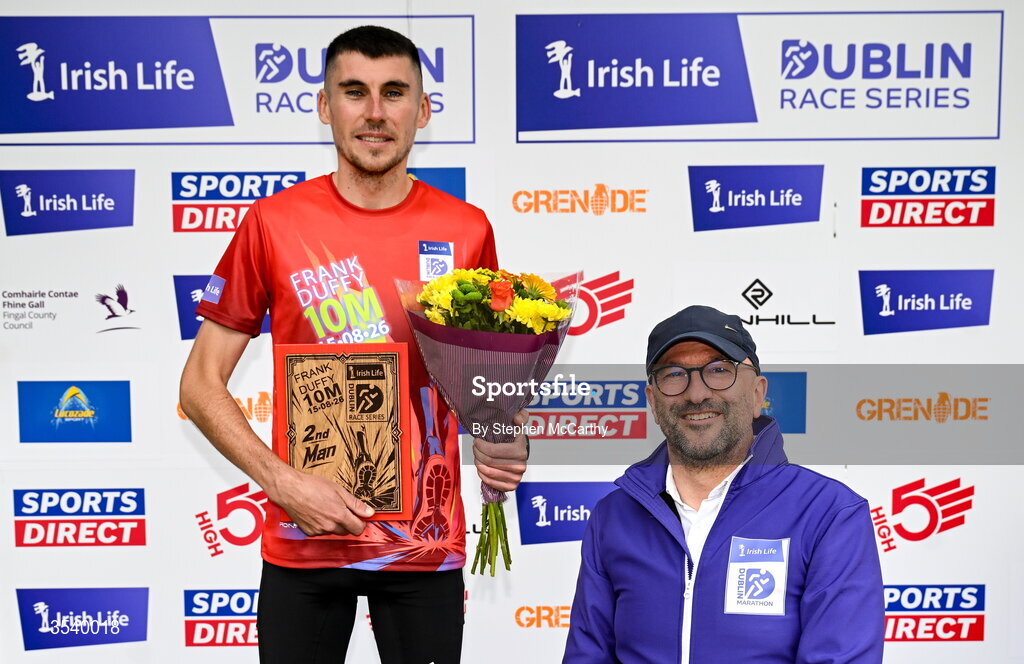 15 August 2026; Michael Brady of Raheny Shamrock AC is presented with his second placed prize by Brendan McEvoy, chief customer marketing society and innovation officer, Irish Life, during the 2026 Irish Life Frank Duffy 10 Mile, in the Phoenix Park, Dublin. Thousands of runners took part in the sold out Irish Life Frank Duffy 10 Mile, the second event in the 2026 Irish Life Dublin Race Series. Photo by Stephen McCarthy/Sportsfile