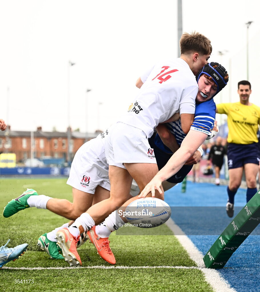 16 August 2026; Ciaran Dunne of Leinster scores his side's first try despite the efforts of JJ McVeigh of Ulster during the U18 Clubs PwC Interprovincial Championship match between Leinster and Ulster at Energia Park in Dublin. Photo by Shauna Clinton/Sportsfile