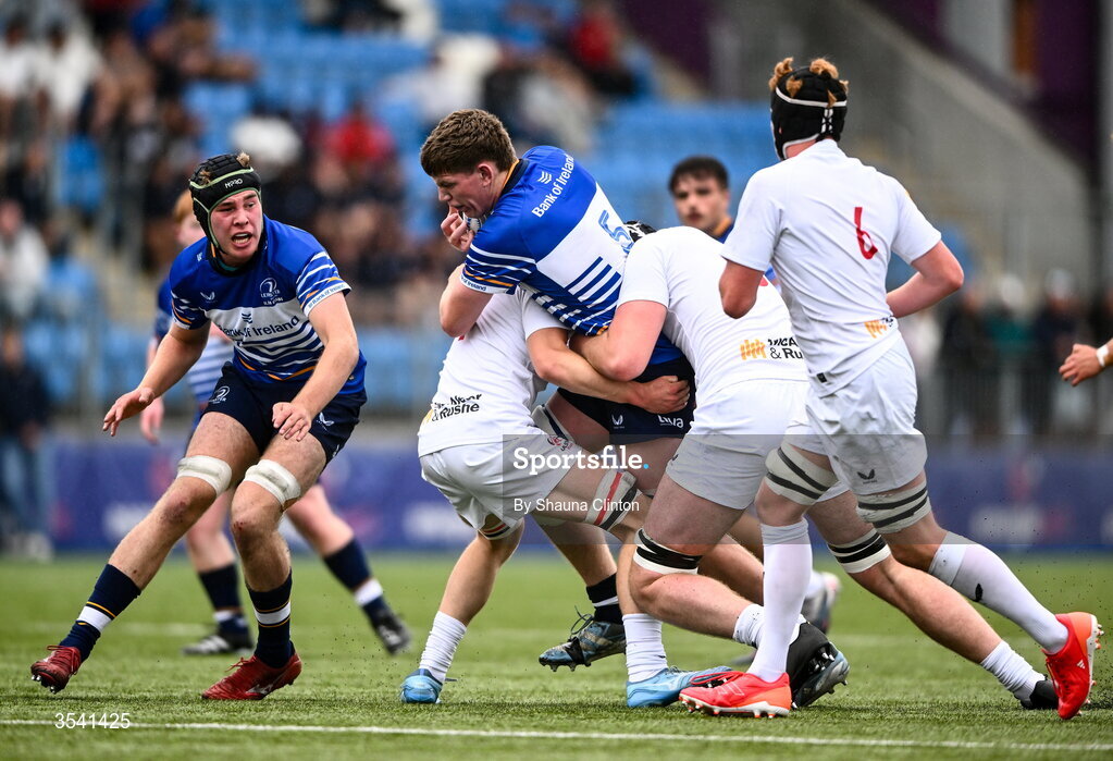16 August 2026; Joe Codd of Leinster is tackled by Ulster players Ewan Morrison, left, and James Fullerton during the U18 Clubs PwC Interprovincial Championship match between Leinster and Ulster at Energia Park in Dublin. Photo by Shauna Clinton/Sportsfile
