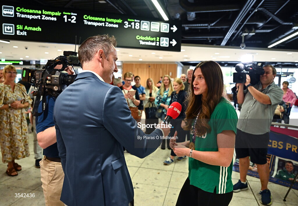 17 August 2026; Women’s heptathlon gold medalist Kate O'Connor is interviewed by Will Dalton of Virgin Media at Dublin Airport on return from the 2026 European Athletics Championships in Birmingham, England. Photo by Piaras Ó Mídheach/Sportsfile