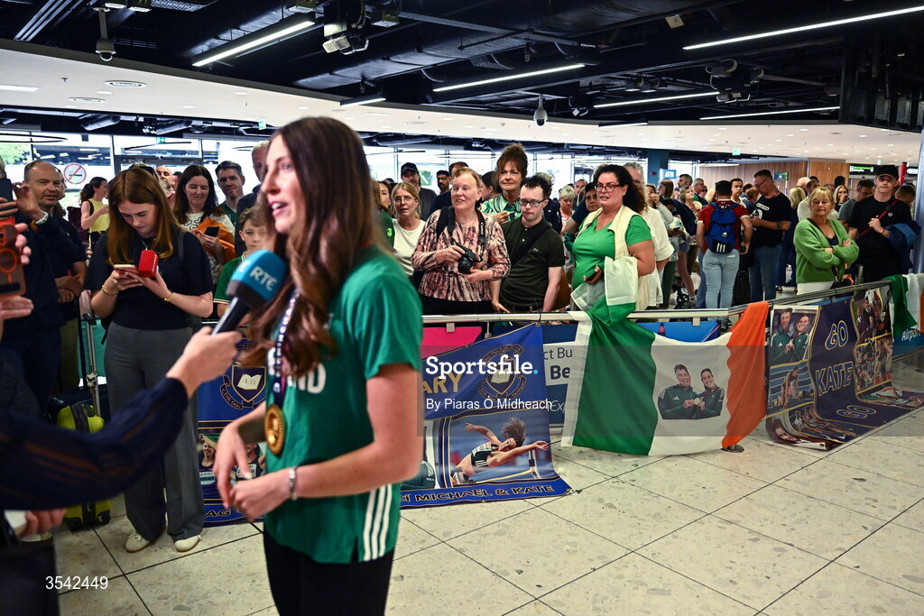 17 August 2026; Women’s heptathlon gold medalist Kate O'Connor is interviewed at Dublin Airport on return from the 2026 European Athletics Championships in Birmingham, England. Photo by Piaras Ó Mídheach/Sportsfile