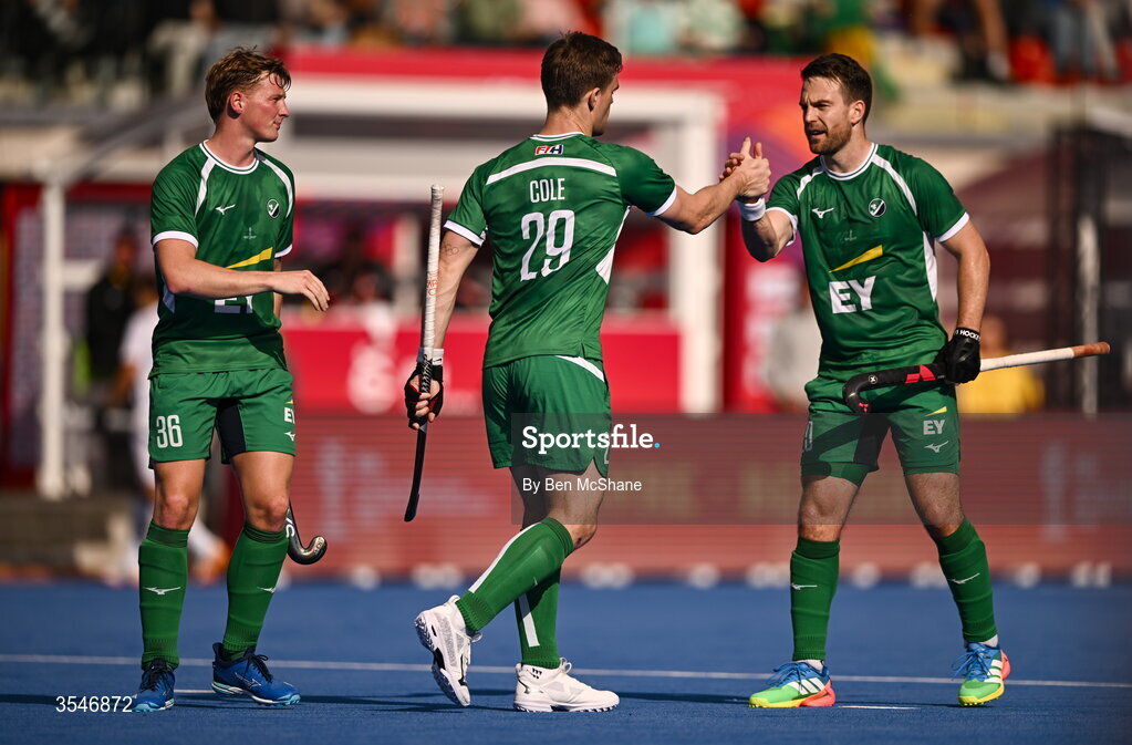 20 August 2026; Lee Cole of Ireland celebrates with teammates Jeremy Duncan, right, and Sam Hyland after scoring their side's first goal, a penalty stroke, during the FIH Men's Hockey World Cup 2026 Pool C match between Ireland and Spain at the Belfius Hockey Arena in Wavre, Belgium. Photo by Ben McShane/Sportsfile