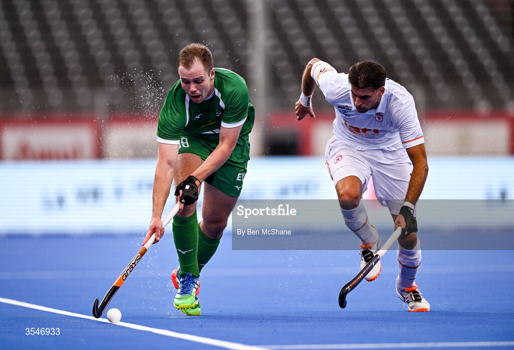 20 August 2026; Fergus Gibson of Ireland in action against Marc Reyne of Spain during the FIH Men's Hockey World Cup 2026 Pool C match between Ireland and Spain at the Belfius Hockey Arena in Wavre, Belgium. Photo by Ben McShane/Sportsfile