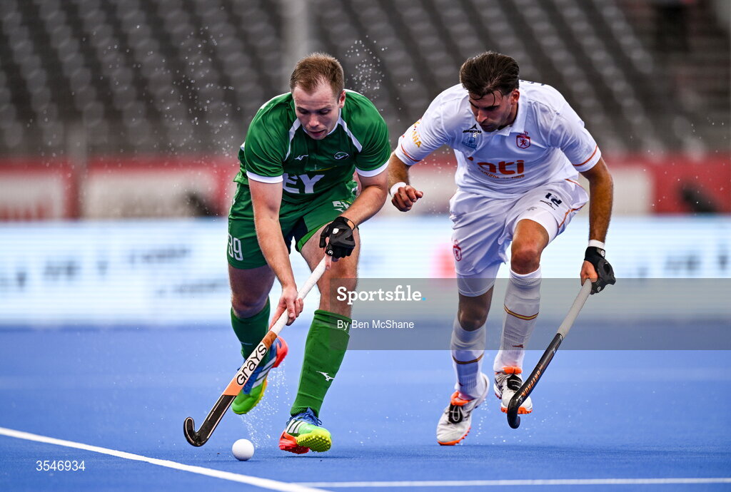 20 August 2026; Fergus Gibson of Ireland in action against Marc Reyne of Spain during the FIH Men's Hockey World Cup 2026 Pool C match between Ireland and Spain at the Belfius Hockey Arena in Wavre, Belgium. Photo by Ben McShane/Sportsfile