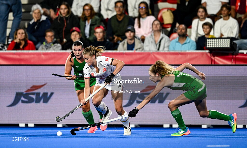 20 August 2026; Alix Gerniers of Belgium in action against Niamh Carey, right, and Mikayla Power of Ireland during the FIH Women's Hockey World Cup 2026 Pool C match between Belgium and Ireland at the Belfius Hockey Arena in Wavre, Belgium. Photo by Ben McShane/Sportsfile
