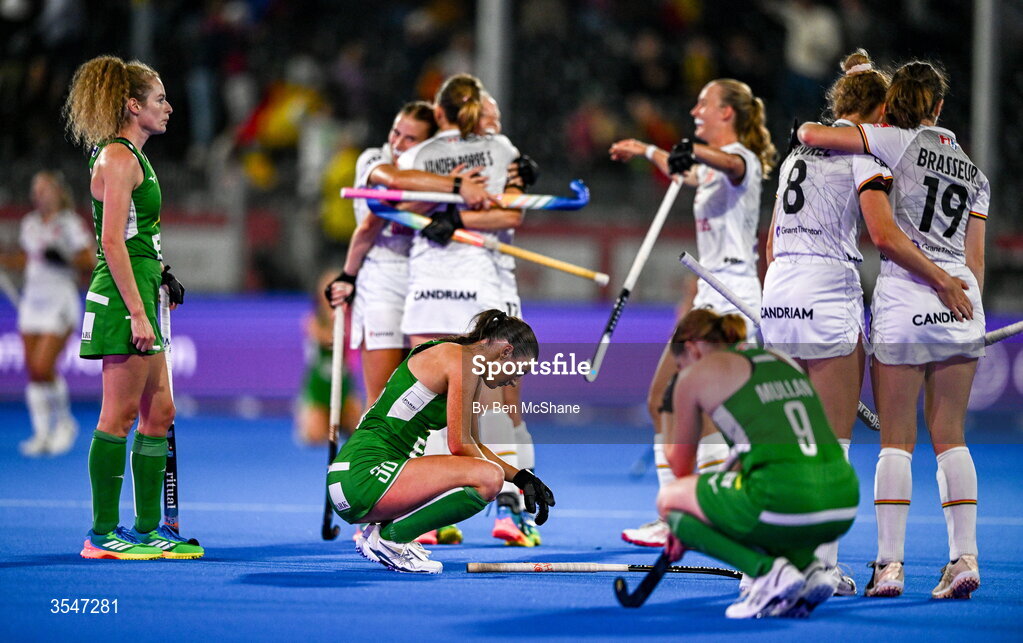 20 August 2026; Ireland players, from left, Niamh Carey, Emily Kealy and Kathryn Mullan, as Belgium players celebrate, after the FIH Women's Hockey World Cup 2026 Pool C match between Belgium and Ireland at the Belfius Hockey Arena in Wavre, Belgium. Photo by Ben McShane/Sportsfile