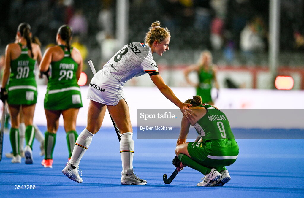 20 August 2026; Kathryn Mullan of Ireland is consoled by Emma Puvrez of Belgium after the FIH Women's Hockey World Cup 2026 Pool C match between Belgium and Ireland at the Belfius Hockey Arena in Wavre, Belgium. Photo by Ben McShane/Sportsfile