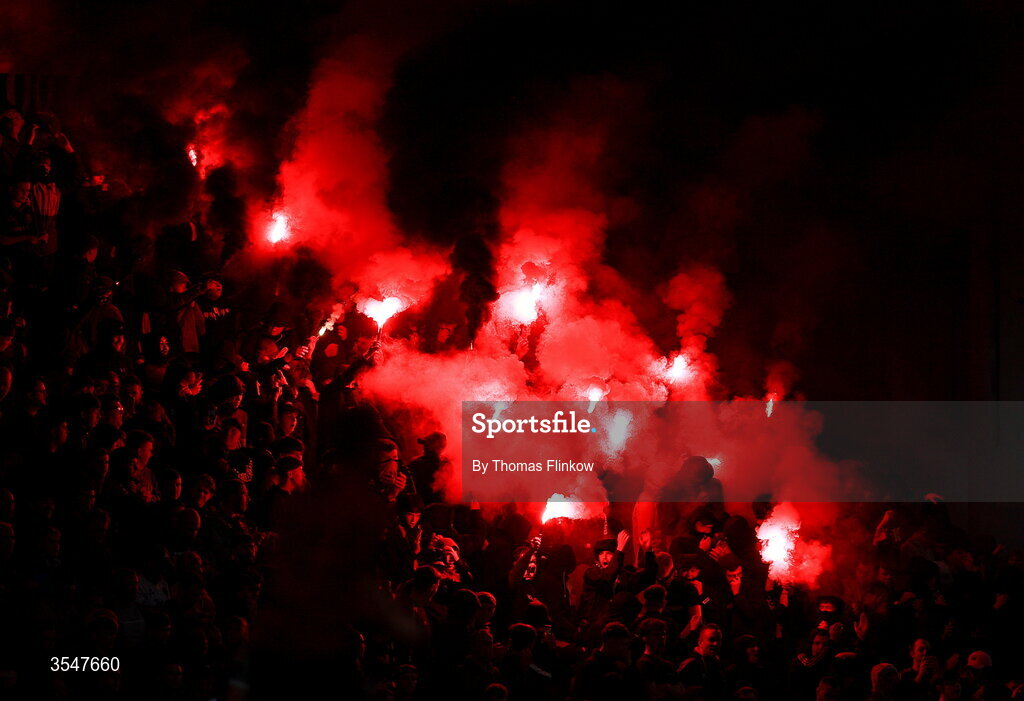 21 August 2026; Bohemians supporters light flares during the SSE Airtricity Men’s Premier Division match between Bohemians and Derry City at Dalymount Park in Dublin. Photo by Thomas Flinkow/Sportsfile