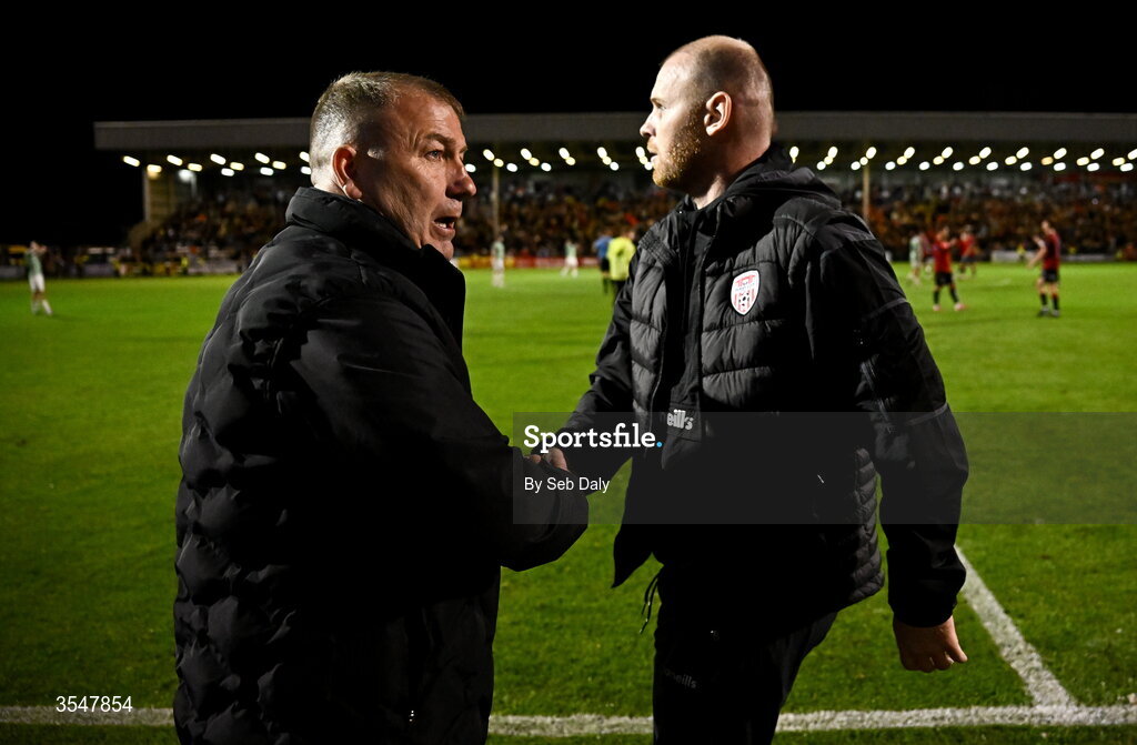 21 August 2026; Bohemians manager Alan Reynolds, left, and Derry City interim manager Mark Connolly shake hands after the SSE Airtricity Men’s Premier Division match between Bohemians and Derry City at Dalymount Park in Dublin. Photo by Seb Daly/Sportsfile