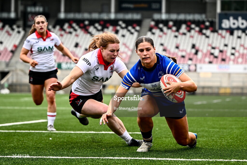22 August 2026; Vicky Elmes Kinlan of Leinster scores her side's second try despite the efforts of Niamh Marley of Ulster during the Vodafone Womens Interprovincial Championship Round 3 match between Ulster and Leinster at Affidea Stadium in Belfast. Photo by Shauna Clinton/Sportsfile