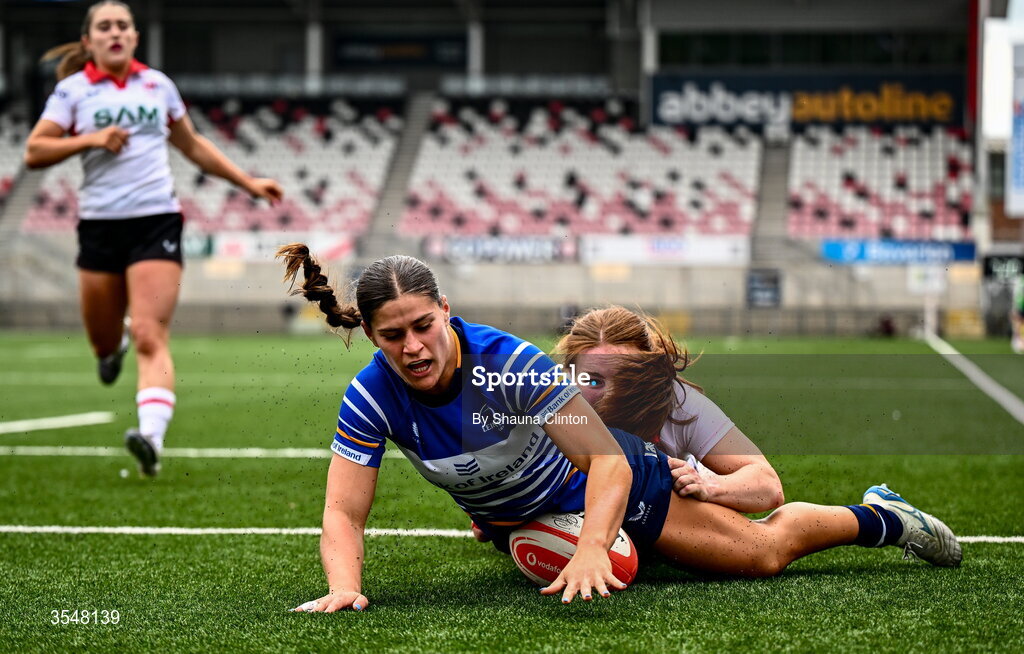 22 August 2026; Vicky Elmes Kinlan of Leinster scores her side's second try despite the efforts of Niamh Marley of Ulster during the Vodafone Womens Interprovincial Championship Round 3 match between Ulster and Leinster at Affidea Stadium in Belfast. Photo by Shauna Clinton/Sportsfile