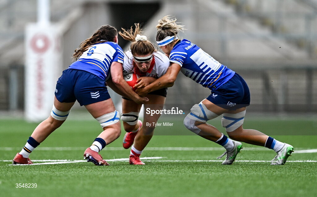 22 August 2026; Claire Boles of Ulster in action against Erin King, right, and Regan Casey of Leinster during the Vodafone Womens Interprovincial Championship Round 3 match between Ulster and Leinster at Affidea Stadium in Belfast. Photo by Tyler Miller/Sportsfile