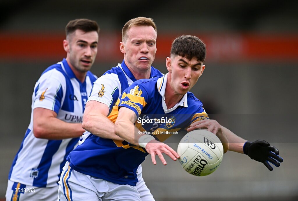 22 August 2026; Eoin Sawyer of Castleknock in action against Brian Bobbett and Harry Donaghy, left, of Ballyboden St Enda's during the PTSB Dublin Senior Club Football Championships Round 2 match between Ballyboden St Enda's and Castleknock at Parnell Park in Dublin. Photo by Piaras Ó Mídheach/Sportsfile