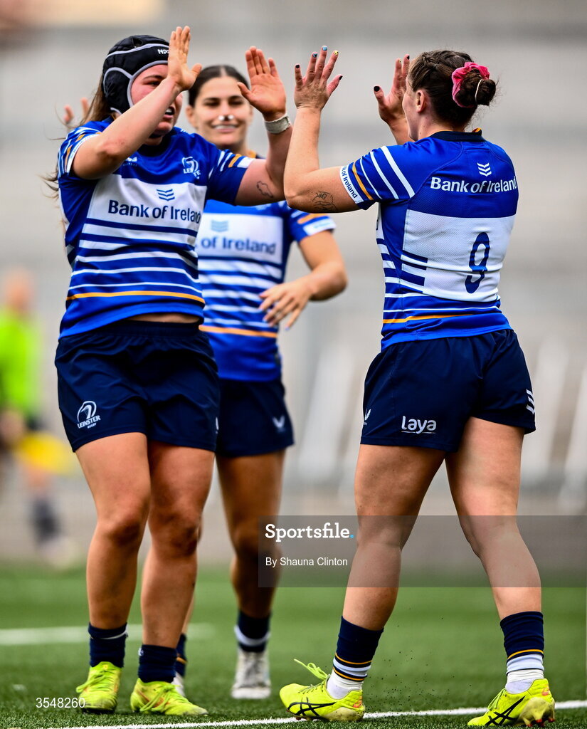 22 August 2026; Katie Whelan of Leinster, right, celebrates with team-mates after scoring her side's seventh try during the Vodafone Womens Interprovincial Championship Round 3 match between Ulster and Leinster at Affidea Stadium in Belfast. Photo by Shauna Clinton/Sportsfile