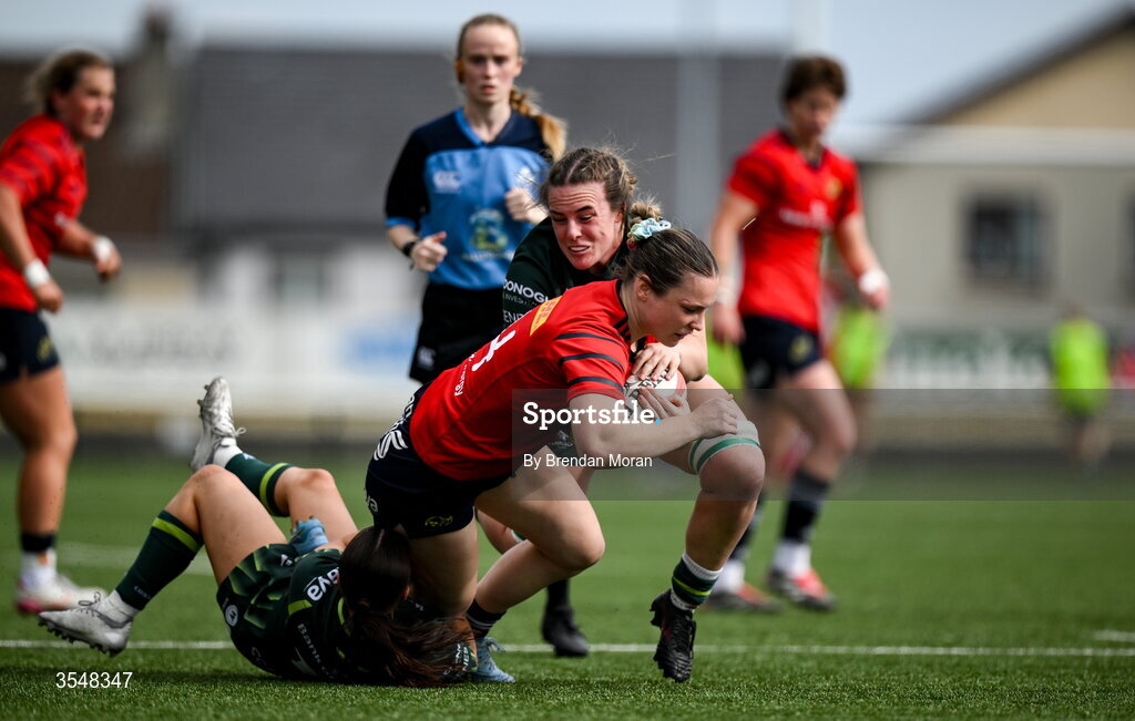 22 August 2026; Alana McInerney of Munster is tackled by Emily Foley and Emma Kelly of Connacht during the Vodafone Womens Interprovincial Championship Round 3 match between Connacht and Munster at Dexcom Stadium in Galway. Photo by Brendan Moran/Sportsfile