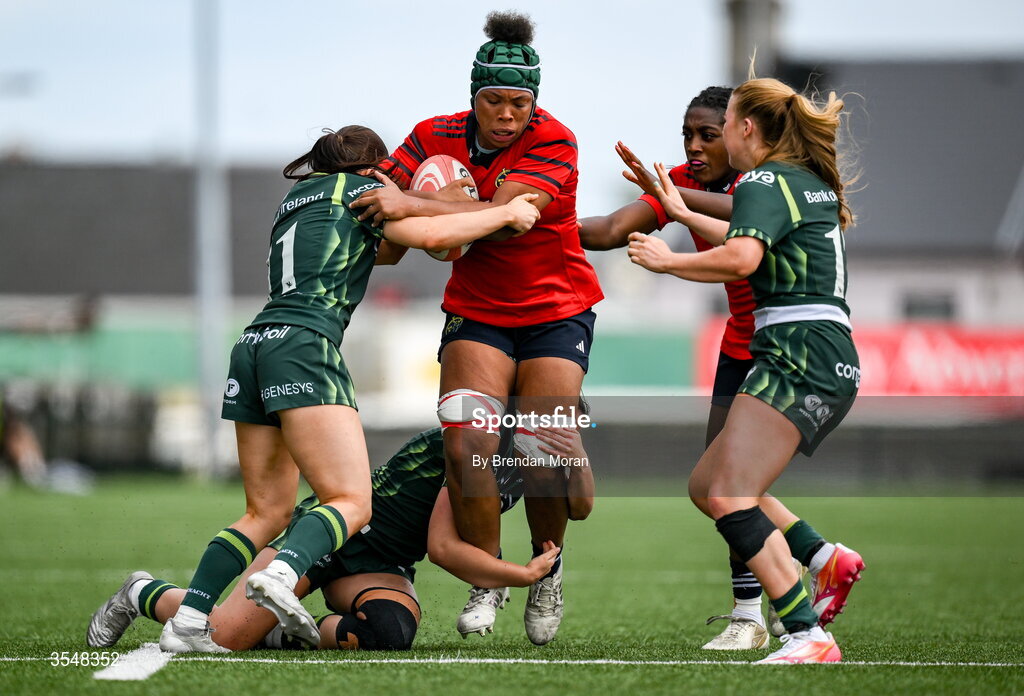 22 August 2026; Grace Moore of Munster is tackled by Connacht players Clara Barrett, Emily Foley and Lyndsay Clarke during the Vodafone Womens Interprovincial Championship Round 3 match between Connacht and Munster at Dexcom Stadium in Galway. Photo by Brendan Moran/Sportsfile