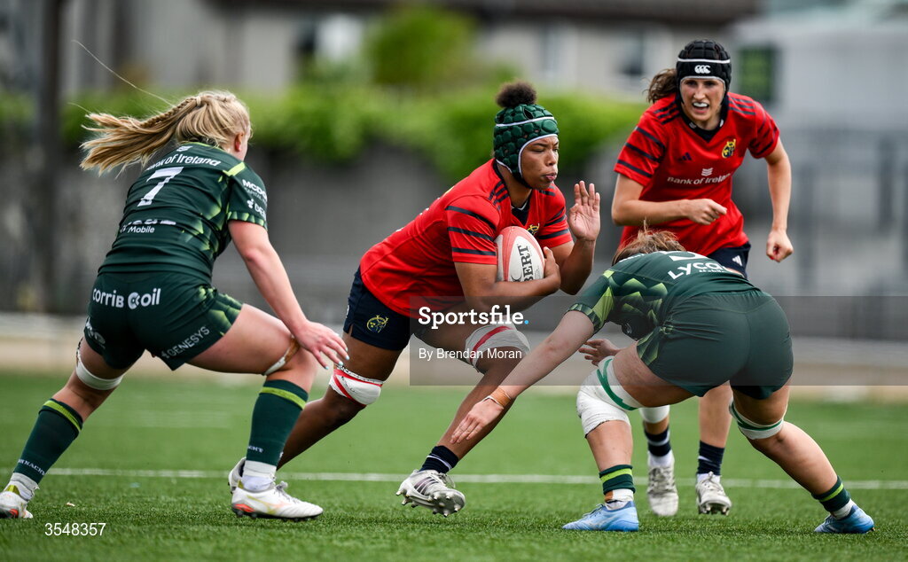 22 August 2026; Grace Moore of Munster in action against Ailish Quinn and Poppy Garvey of Connacht during the Vodafone Womens Interprovincial Championship Round 3 match between Connacht and Munster at Dexcom Stadium in Galway. Photo by Brendan Moran/Sportsfile