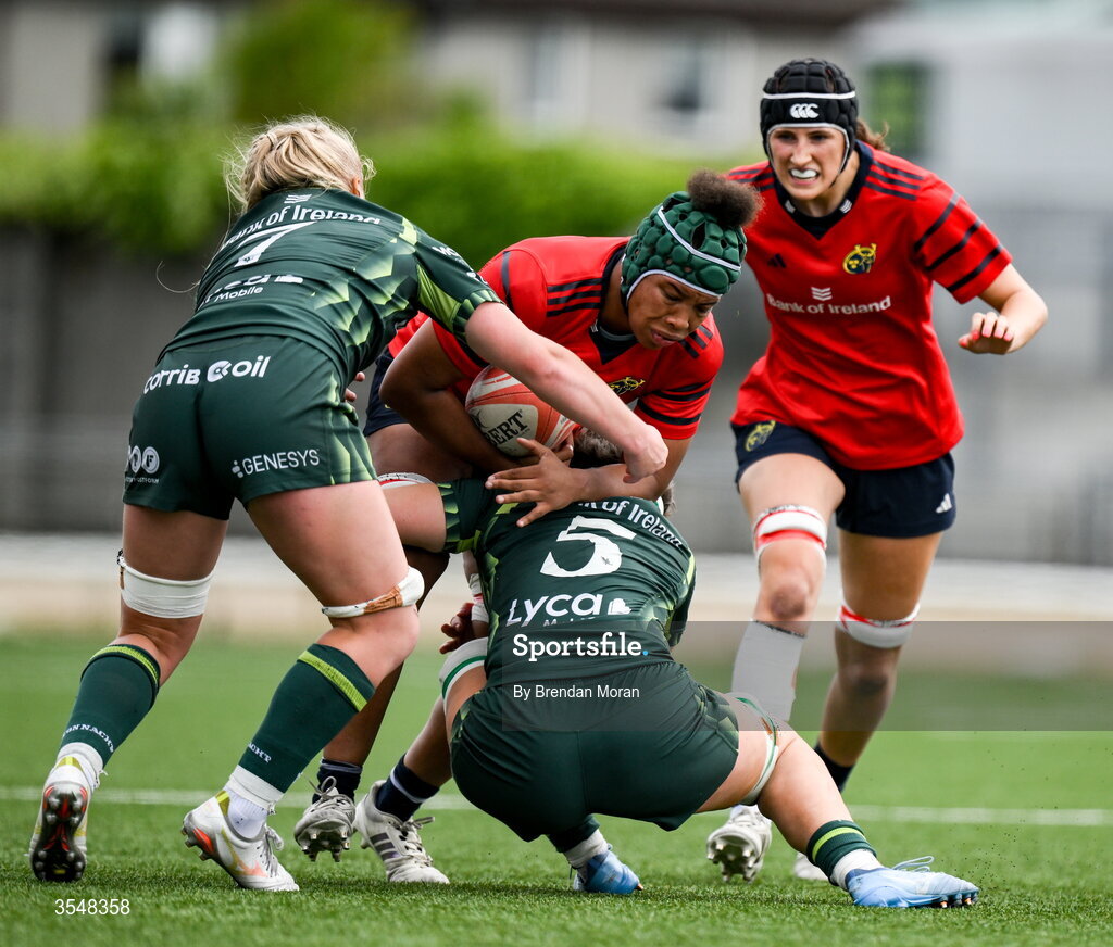 22 August 2026; Grace Moore of Munster in action against Ailish Quinn and Poppy Garvey of Connacht during the Vodafone Womens Interprovincial Championship Round 3 match between Connacht and Munster at Dexcom Stadium in Galway. Photo by Brendan Moran/Sportsfile