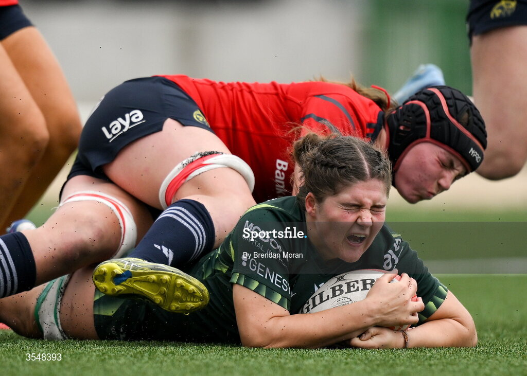 22 August 2026; Jemima Adams Verling of Connacht scores her side's second try despite the tackle of Sally Kelly of Munster during the Vodafone Womens Interprovincial Championship Round 3 match between Connacht and Munster at Dexcom Stadium in Galway. Photo by Brendan Moran/Sportsfile