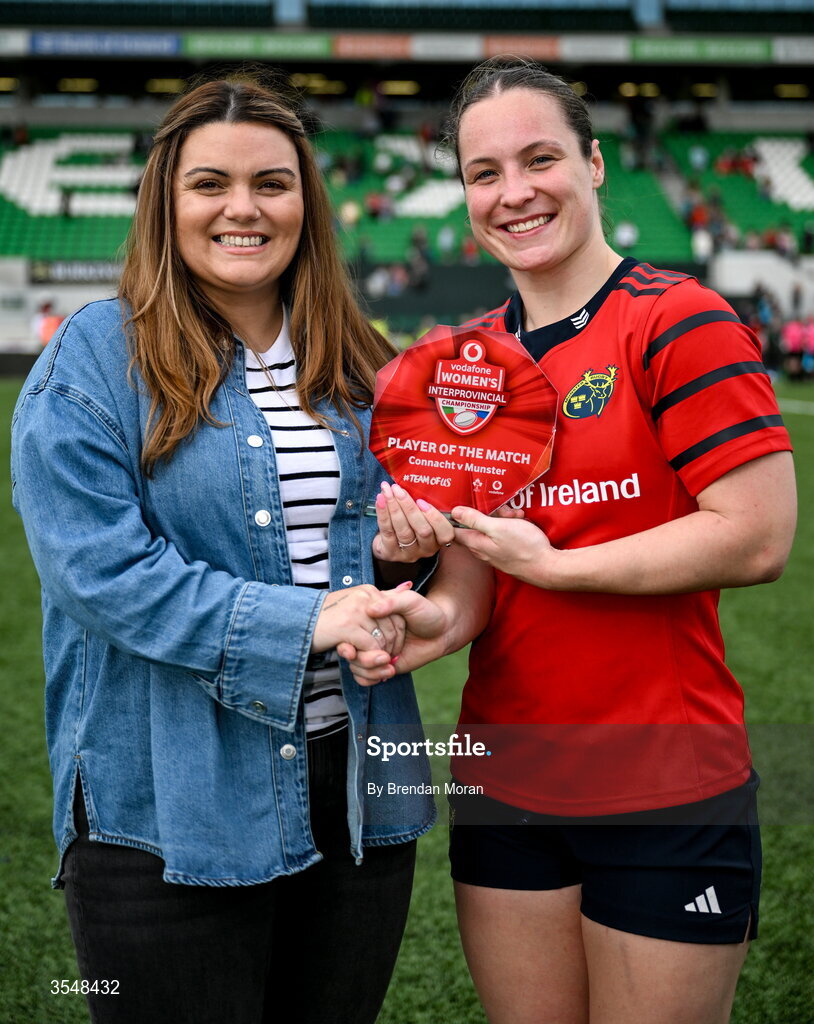 22 August 2026; Alana McInerney of Munster is presented with the Vodafone Player of the Match award by Nikki Hall of Vodafone after the Vodafone Womens Interprovincial Championship Round 3 match between Connacht and Munster at Dexcom Stadium in Galway. Photo by Brendan Moran/Sportsfile