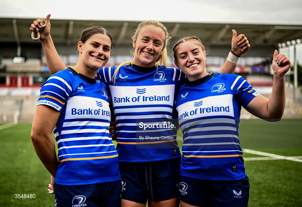 22 August 2026; Leinster players, from left, Vicky Elmes Kinlan, Stacey Flood and Katie Whelan after their side's victory in the Vodafone Womens Interprovincial Championship Round 3 match between Ulster and Leinster at Affidea Stadium in Belfast. Photo by Shauna Clinton/Sportsfile