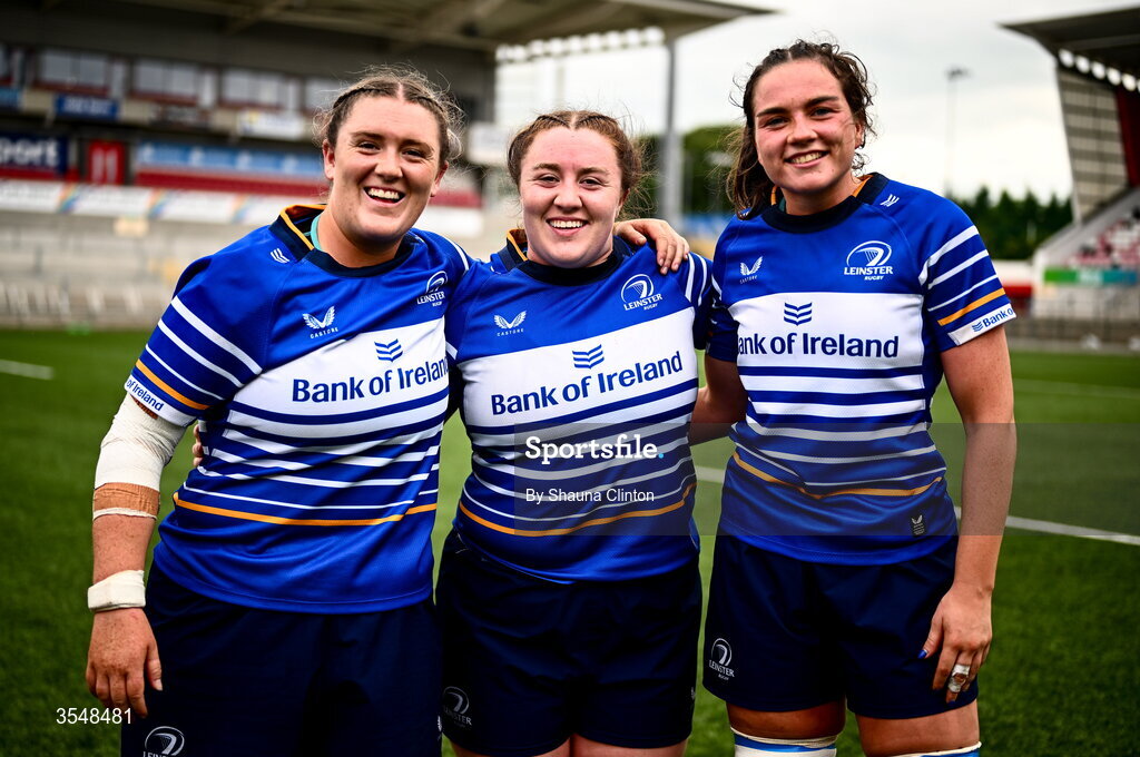 22 August 2026; Leinster players, from left, Hannah Wilson, Emma-Jane Wilson and Kate Jordan after their side's victory in the Vodafone Womens Interprovincial Championship Round 3 match between Ulster and Leinster at Affidea Stadium in Belfast. Photo by Shauna Clinton/Sportsfile