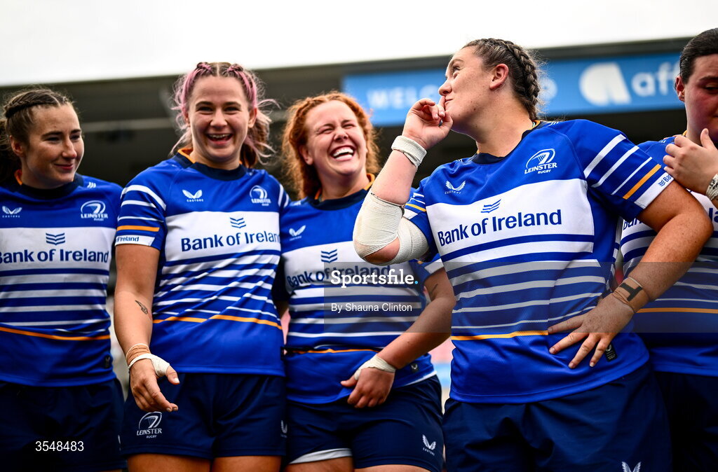 22 August 2026; Hannah Wilson of Leinster, right, and team-mates celebrate after the Vodafone Womens Interprovincial Championship Round 3 match between Ulster and Leinster at Affidea Stadium in Belfast. Photo by Shauna Clinton/Sportsfile
