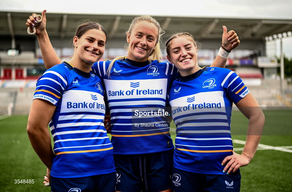 22 August 2026; Leinster players, from left, Vicky Elmes Kinlan, Stacey Flood and Katie Whelan after their side's victory in the Vodafone Womens Interprovincial Championship Round 3 match between Ulster and Leinster at Affidea Stadium in Belfast. Photo by Shauna Clinton/Sportsfile