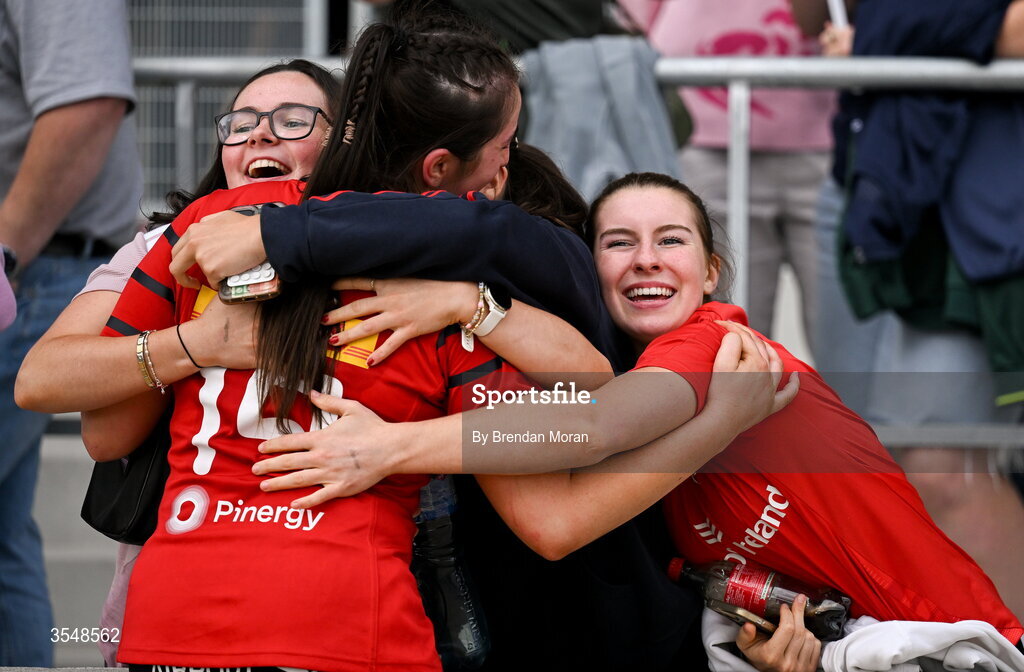 22 August 2026; Niamh O'Mahony of Munster celebrates with her friends after making her debut in the Vodafone Womens Interprovincial Championship Round 3 match between Connacht and Munster at Dexcom Stadium in Galway. Photo by Brendan Moran/Sportsfile