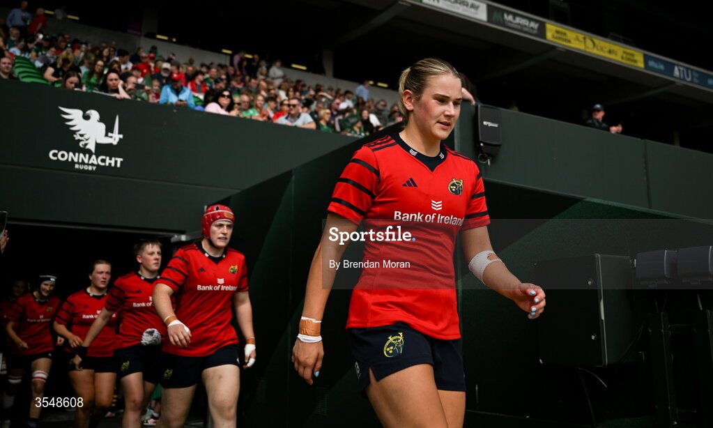 22 August 2026; Munster captain Aoife Corey walks onto the pitch before the Vodafone Womens Interprovincial Championship Round 3 match between Connacht and Munster at Dexcom Stadium in Galway. Photo by Brendan Moran/Sportsfile