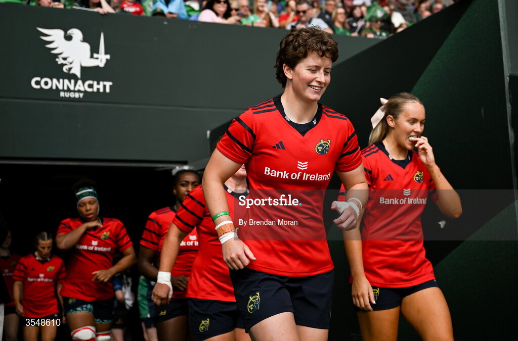 22 August 2026; Caitríona Finn, centre, and Lucia Linn of Munster walk onto the pitch before the Vodafone Womens Interprovincial Championship Round 3 match between Connacht and Munster at Dexcom Stadium in Galway. Photo by Brendan Moran/Sportsfile