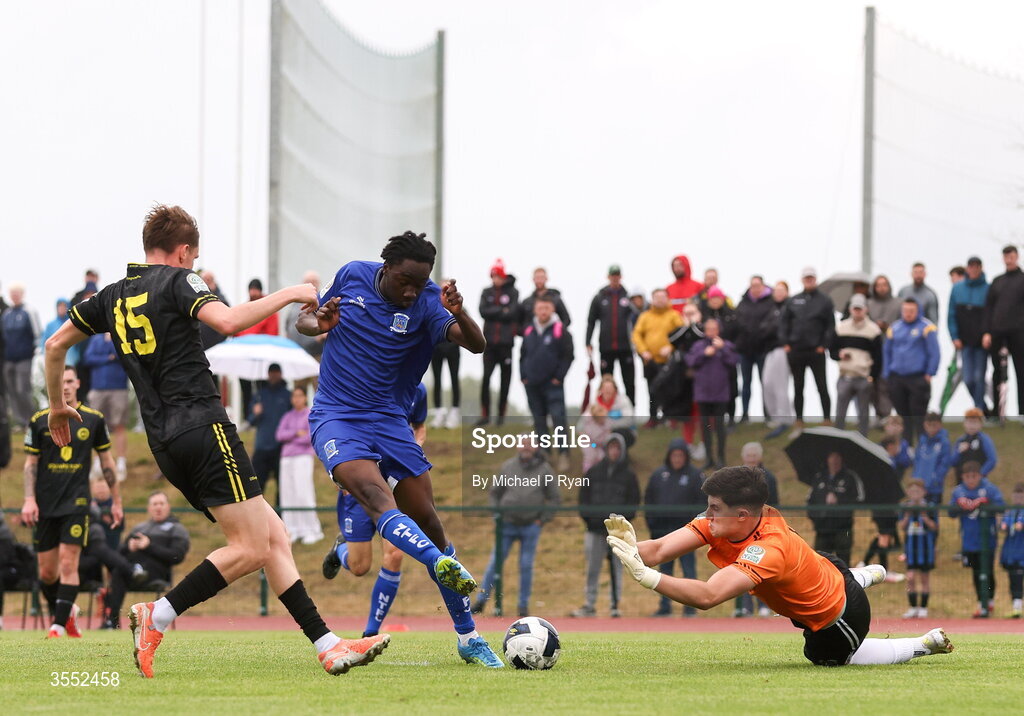 29 August 2026; Alex Akinrintoyo of Newbridge Town has a shot on goal saved by CK United goalkeeper Gavin O'Brien during the FAI National League Group 3 match between CK United and Newbridge Town at SETU Sports Complex in Carlow. Photo by Michael P Ryan/Sportsfile