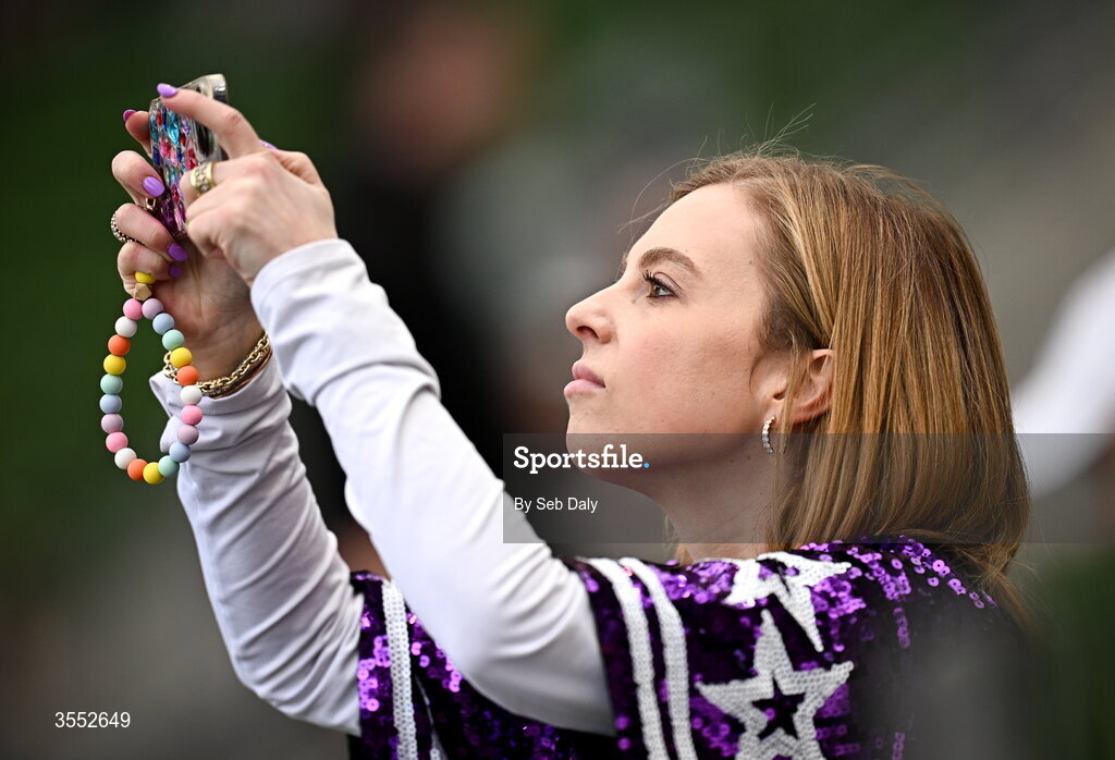 29 August 2026; A TCU supporter takes a photo before the 2026 Aer Lingus College Football Classic match between TCU and North Carolina at the Aviva Stadium in Dublin. Photo by Seb Daly/Sportsfile
