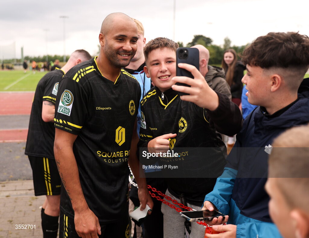 29 August 2026; Ethan Boyle of CK United poses for a photograph with a supporter after the FAI National League Group 3 match between CK United and Newbridge Town at SETU Sports Complex in Carlow. Photo by Michael P Ryan/Sportsfile