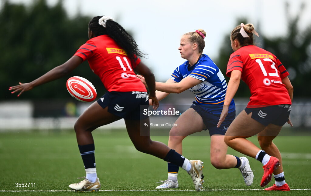 29 August 2026; Dannah O’Brien of Leinster in action against Munster players Chisom Ugwueru, left, and Lucia Linn during the Vodafone Womens Interprovincial Championship final match between Munster and Leinster at Dexcom Stadium in Galway. Photo by Shauna Clinton/Sportsfile