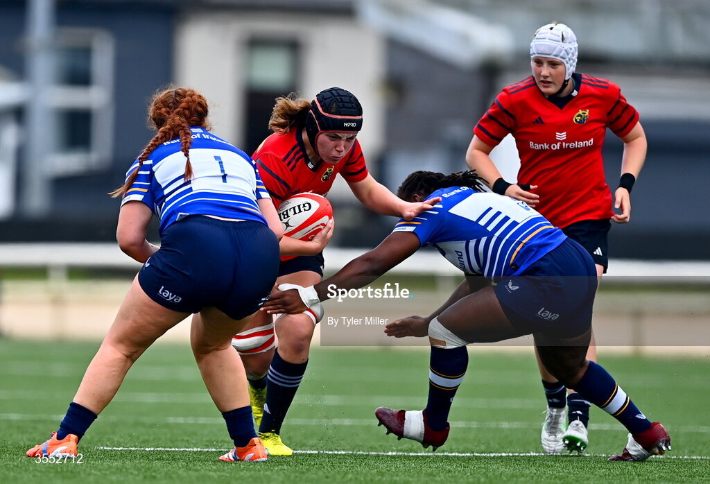 29 August 2026; Sally Kelly of Munster is tackled by Caoimhe Molloy, left, and Linda Djougang of Leinster during the Vodafone Womens Interprovincial Championship final match between Munster and Leinster at Dexcom Stadium in Galway. Photo by Tyler Miller/Sportsfile