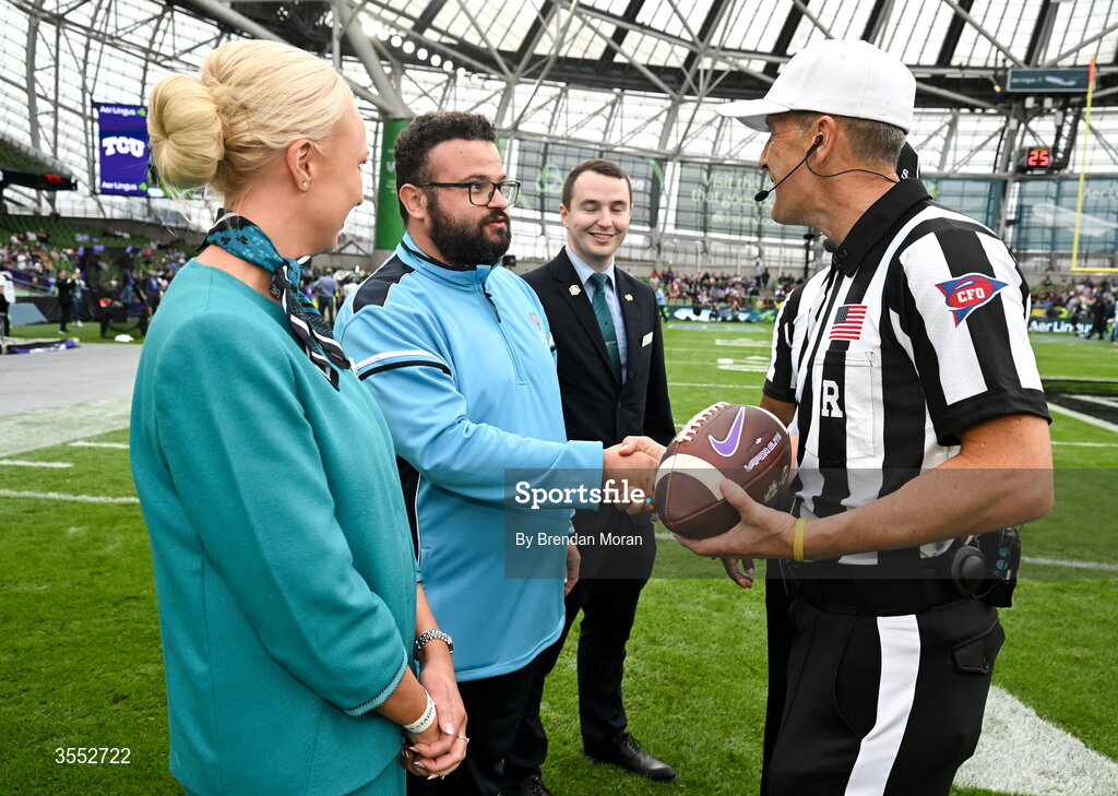 29 August 2026; Game Ball delivery by Special Olympics Ireland athlete Omer Teko with Aer Lingus cabin crew Jillian McDonald and Darragh McGrath to Referee Mike Roche before the 2026 Aer Lingus College Football Classic match between TCU and North Carolina at the Aviva Stadium in Dublin. Photo by Brendan Moran/Sportsfile