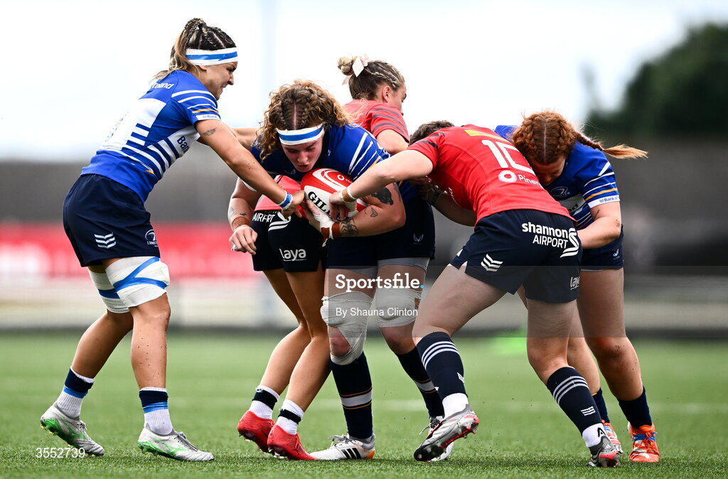 29 August 2026; Ruth Campbell of Leinster is tackled by Munster players Lucia Linn, left, and Caitríona Finn during the Vodafone Womens Interprovincial Championship final match between Munster and Leinster at Dexcom Stadium in Galway. Photo by Shauna Clinton/Sportsfile