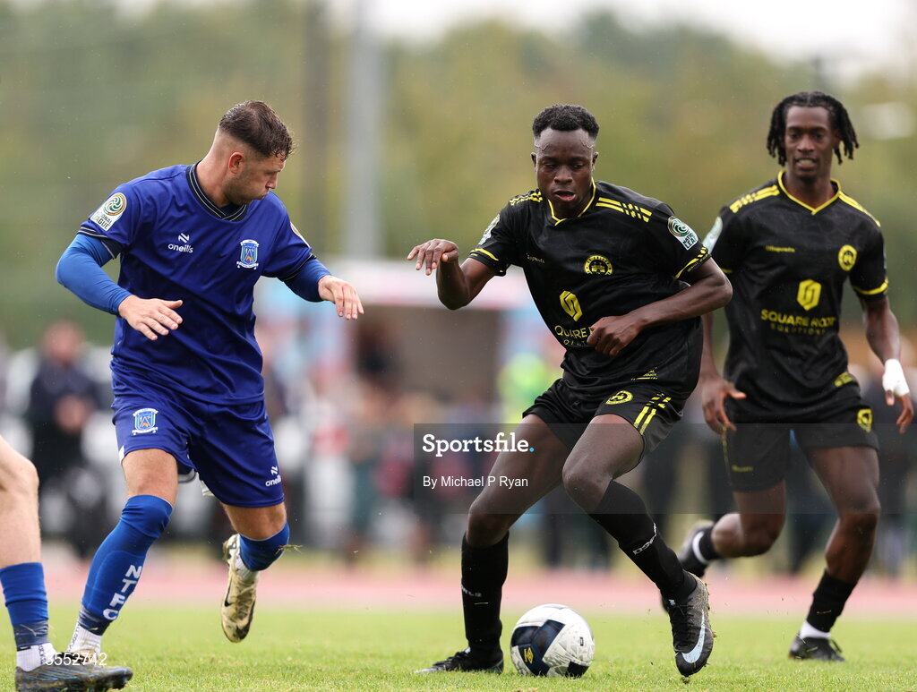 29 August 2026; Raveli Kilonda of CK United in action against Ethan Mills of Newbridge Town during the FAI National League Group 3 match between CK United and Newbridge Town at SETU Sports Complex in Carlow. Photo by Michael P Ryan/Sportsfile