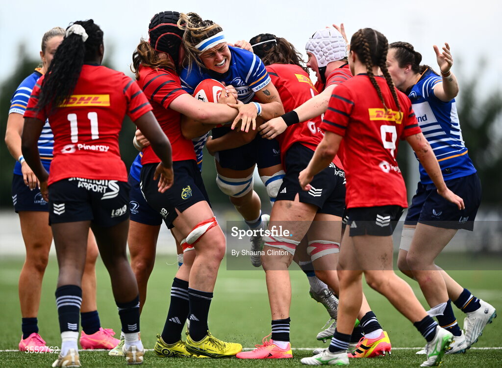 29 August 2026; Erin King of Leinster is tackled by Munster players Sally Kelly, left, and Aoibhe O’Flynn during the Vodafone Womens Interprovincial Championship final match between Munster and Leinster at Dexcom Stadium in Galway. Photo by Shauna Clinton/Sportsfile