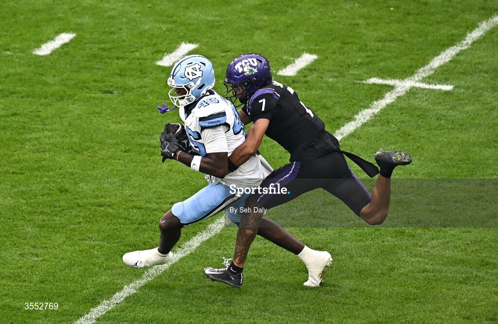 29 August 2026; North Carolina tight end Jelani Thurman #45 is tackled by TCU safety Julius Simms #7 during the 2026 Aer Lingus College Football Classic match between TCU and North Carolina at the Aviva Stadium in Dublin. Photo by Seb Daly/Sportsfile