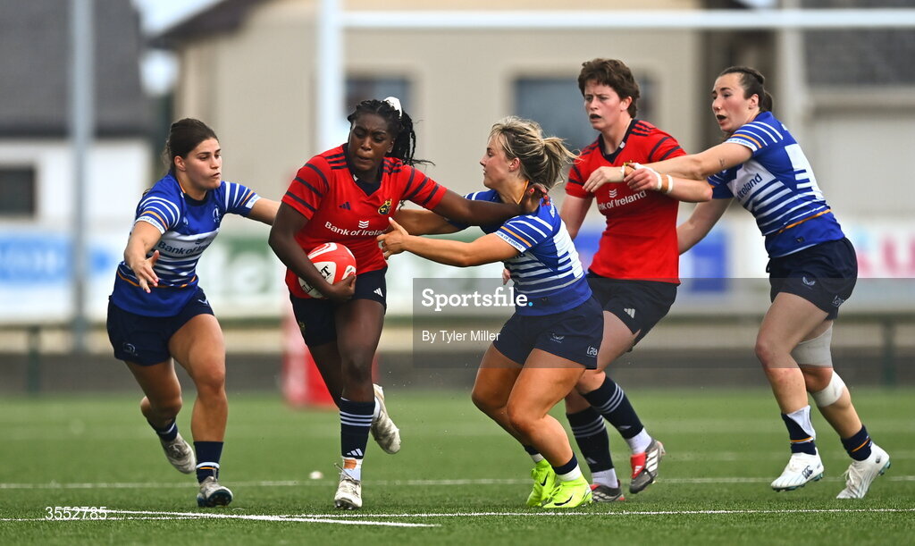 29 August 2026; Chisom Ugwueru of Munster is tackled by Aoife Dalton, right, and Vicky Elmes Kinlan of Leinster during the Vodafone Womens Interprovincial Championship final match between Munster and Leinster at Dexcom Stadium in Galway. Photo by Tyler Miller/Sportsfile