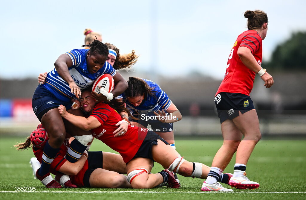 29 August 2026; Linda Djougang of Leinster is tackled by Munster players Siobhan McCarthy, left, and Maeve Óg O’Leary during the Vodafone Womens Interprovincial Championship final match between Munster and Leinster at Dexcom Stadium in Galway. Photo by Shauna Clinton/Sportsfile