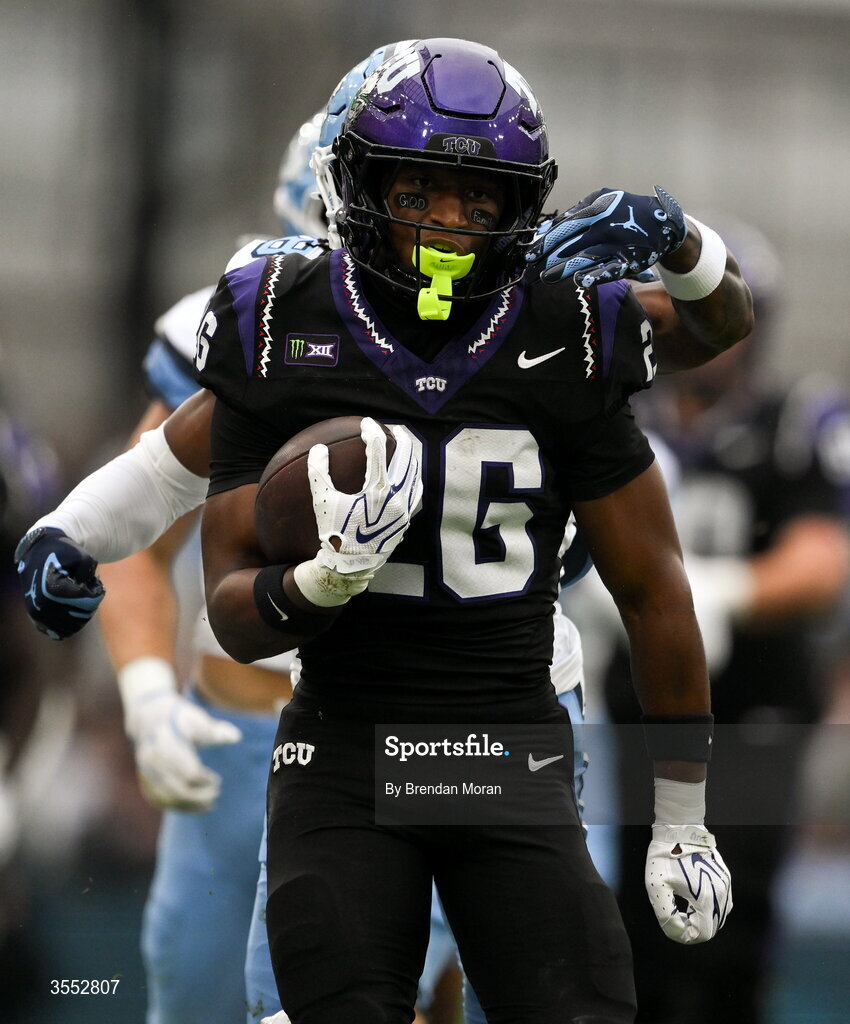 29 August 2026; TCU running back Jeremy Payne #26 is tackled by North Carolina defensive back Jaiden Patterson #18 during the 2026 Aer Lingus College Football Classic match between TCU and North Carolina at the Aviva Stadium in Dublin. Photo by Brendan Moran/Sportsfile