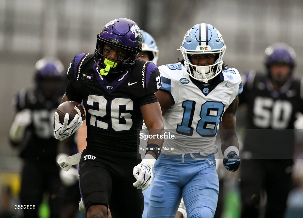 29 August 2026; TCU running back Jeremy Payne #26 in action against North Carolina defensive back Jaiden Patterson #18 during the 2026 Aer Lingus College Football Classic match between TCU and North Carolina at the Aviva Stadium in Dublin. Photo by Brendan Moran/Sportsfile