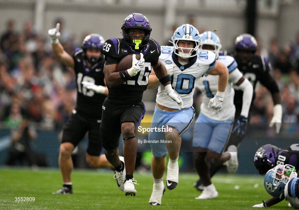 29 August 2026; TCU running back Jeremy Payne #26 in action against North Carolina defensive back Jaiden Patterson #18 during the 2026 Aer Lingus College Football Classic match between TCU and North Carolina at the Aviva Stadium in Dublin. Photo by Brendan Moran/Sportsfile