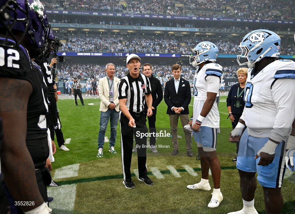 29 August 2026; Referee Mike Roche performs the coin toss before during the 2026 Aer Lingus College Football Classic match between TCU and North Carolina at the Aviva Stadium in Dublin. Photo by Brendan Moran/Sportsfile