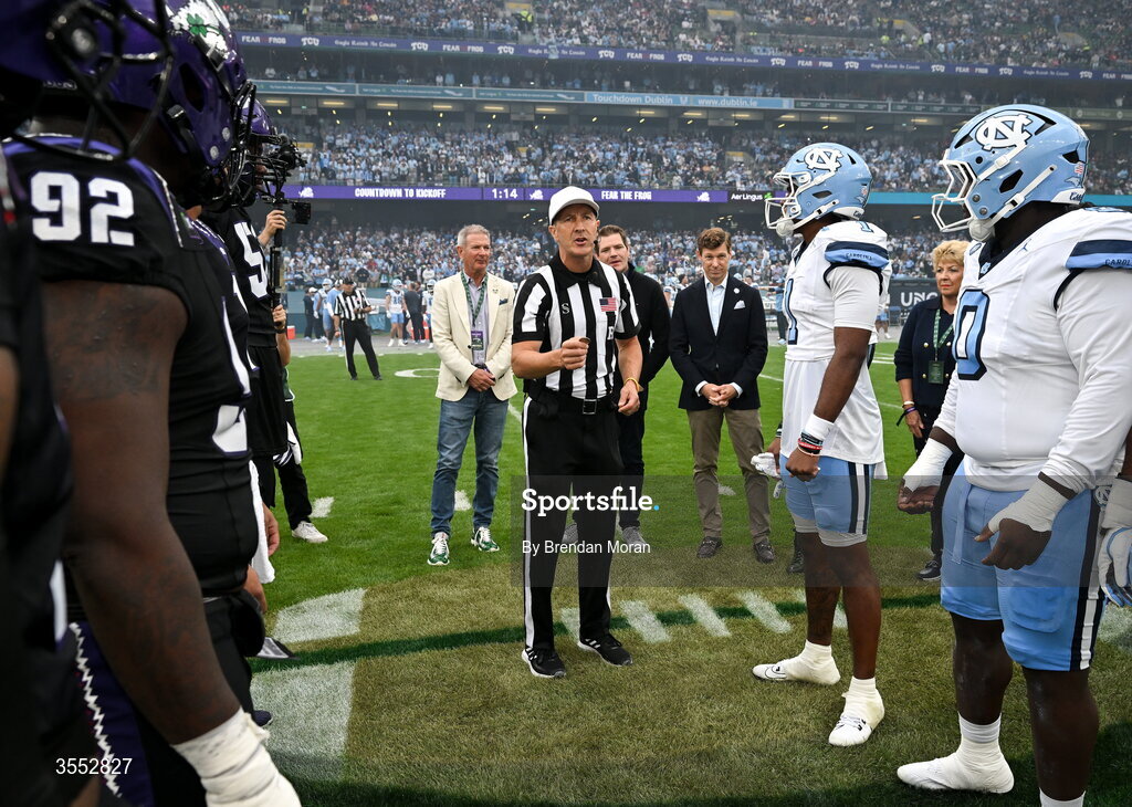 29 August 2026; Referee Mike Roche performs the coin toss before during the 2026 Aer Lingus College Football Classic match between TCU and North Carolina at the Aviva Stadium in Dublin. Photo by Brendan Moran/Sportsfile