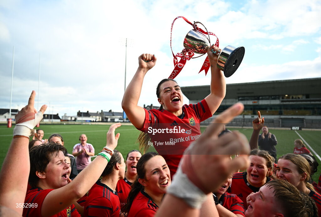 29 August 2026; Munster captain Maeve Óg O’Leary celebrates with the trophy and her team-mates after the Vodafone Womens Interprovincial Championship final match between Munster and Leinster at Dexcom Stadium in Galway. Photo by Tyler Miller/Sportsfile